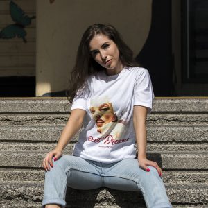 Woman wearing Marilyn Monroe Sweet Dreams t-shirt with vintage portrait print