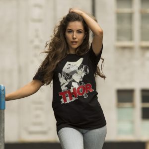 Woman wearing black Fifi Lloyd Thor t-shirt with hero illustration