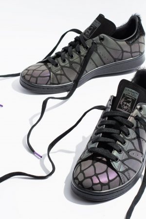 Adidas holographic trainers shown as a pair under matte lighting