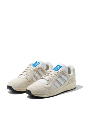 Adidas ZX 420 cream suede trainers from front angled view