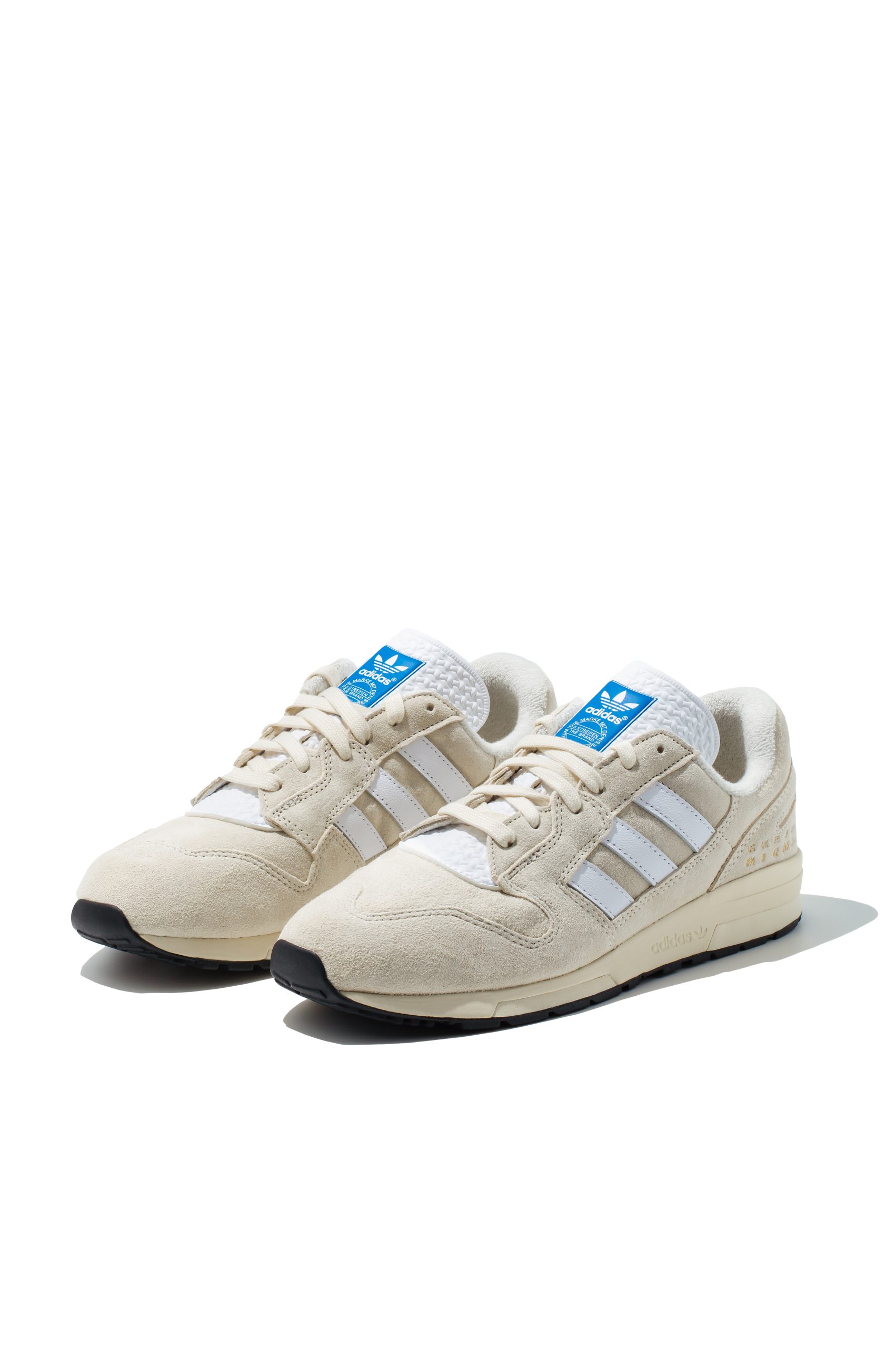 Adidas ZX 420 cream suede trainers from front angled view
