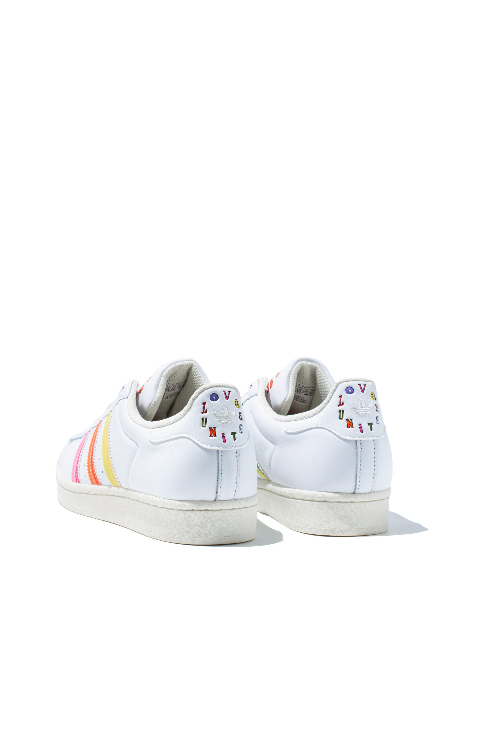 Pair of Adidas Superstar Pride trainers in white with rainbow detailing