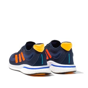 Pair of Adidas Supernova running trainers in navy and orange from rear view