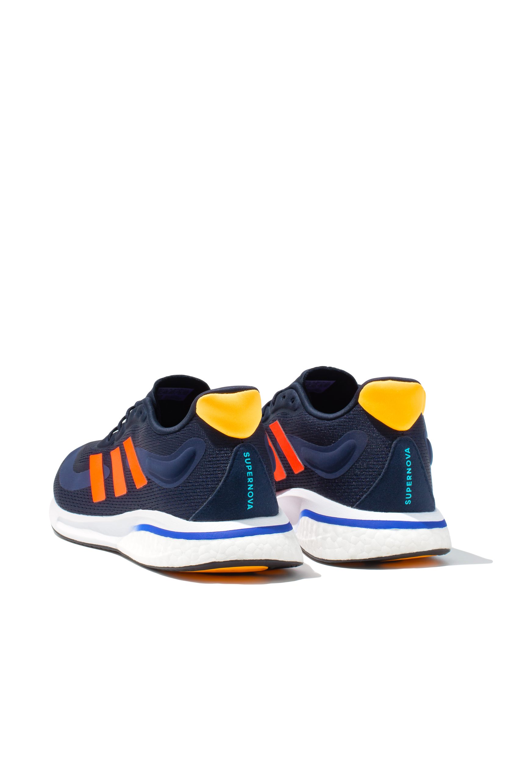 Pair of Adidas Supernova running trainers in navy and orange from rear view